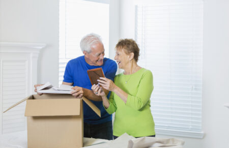 A senior coupling packing a box
