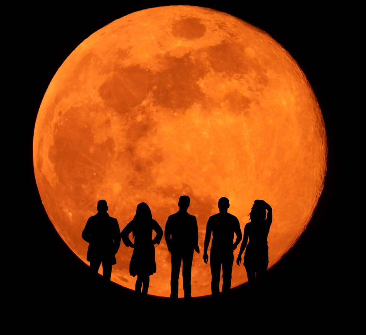 Silhouettes in an eclipsed moon
